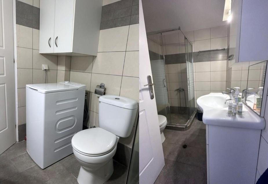 bagno bianco con servizi igienici e lavandino di IFESTIA HOUSE ad Agia Paraskevi