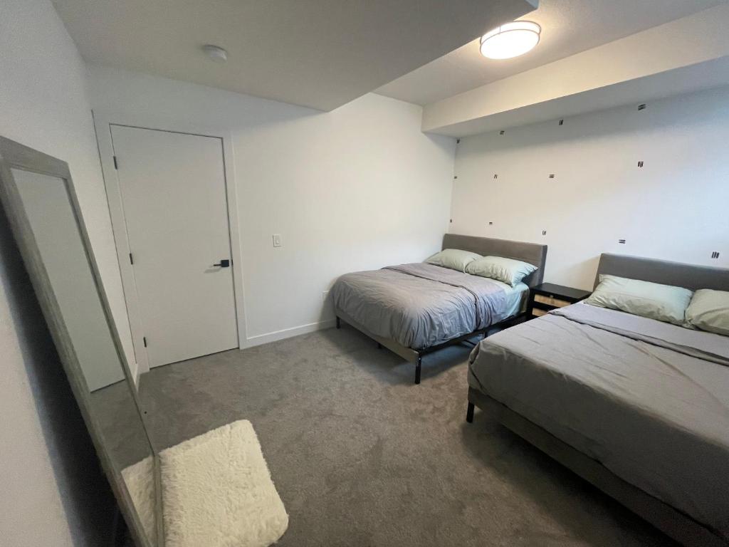 Voodi või voodid majutusasutuse Emerald Suite with 2 beds toas