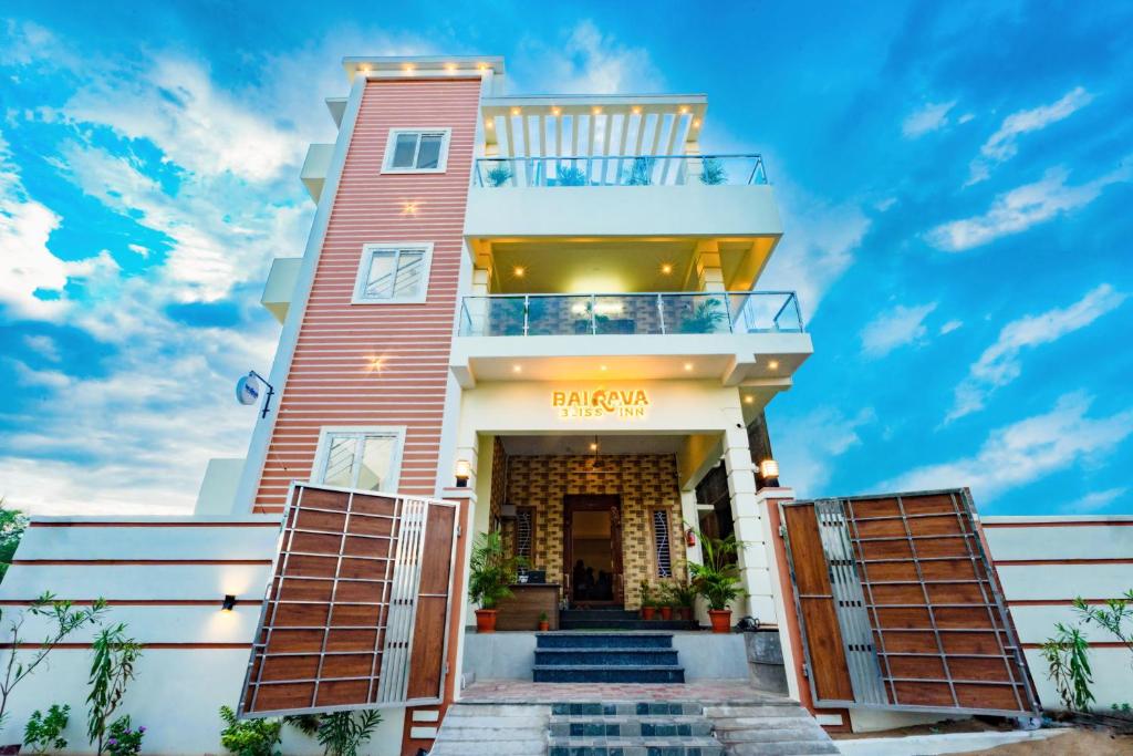 a view of the front of a house with a balcony at Bairava Bliss Inn in Rāmeswaram