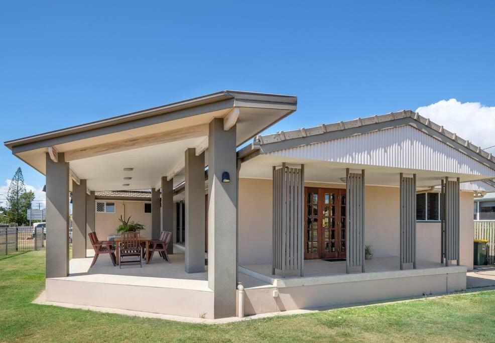 a house with a patio with a roof at Your Home at Southside Central - Family friendly. in Bundaberg