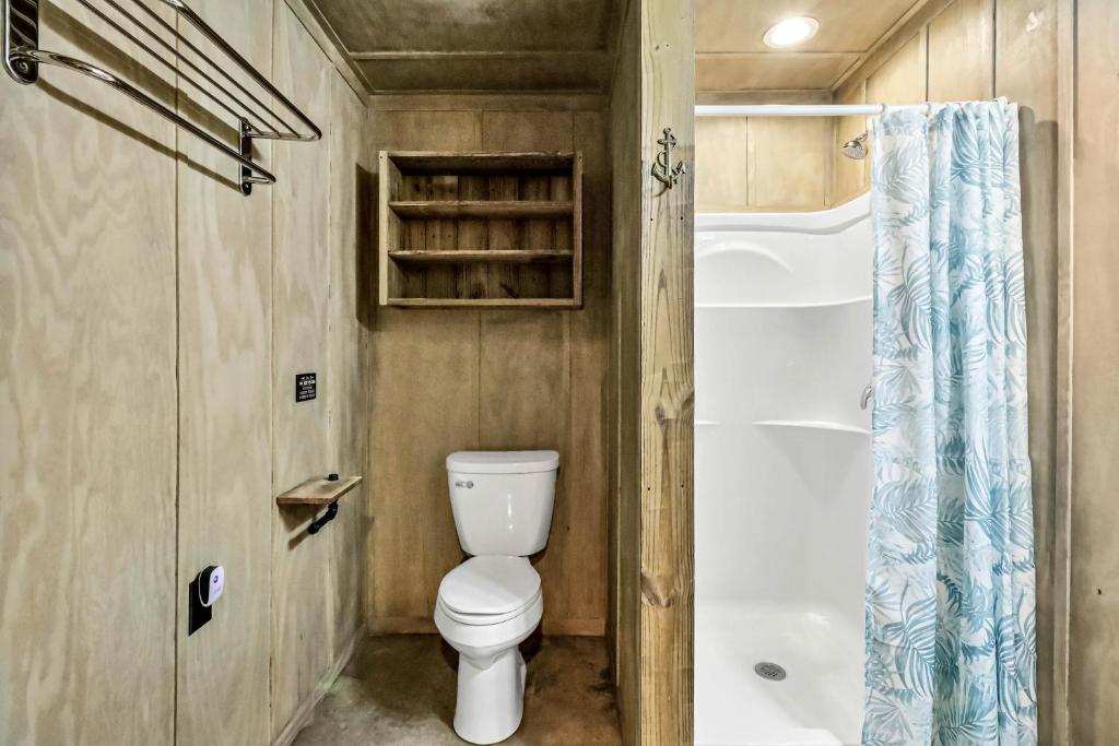 a bathroom with a toilet and a shower at Casas Coastal Experience Cabin A in Rockport