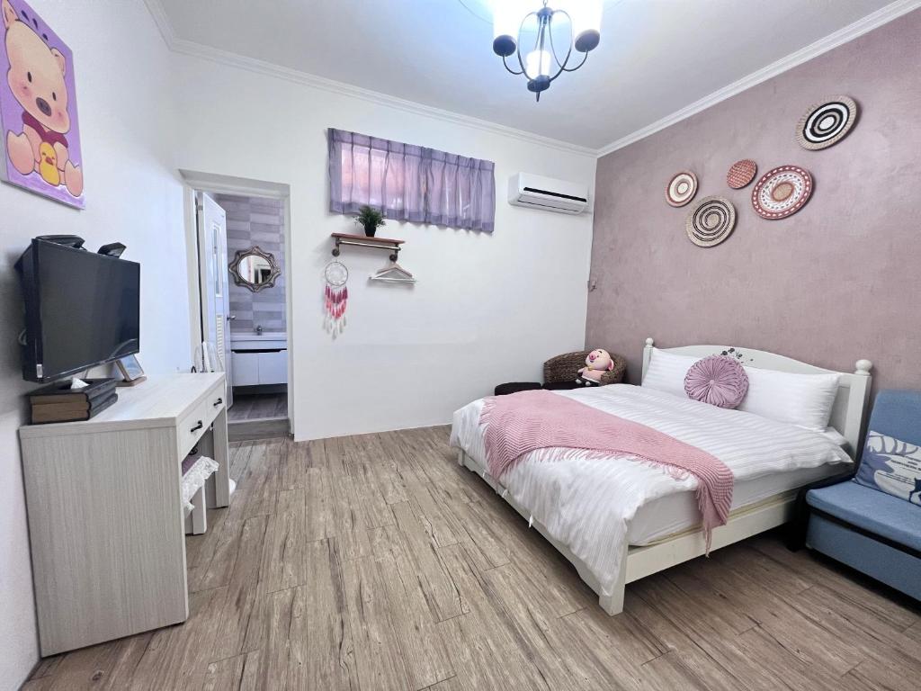 Postel nebo postele na pokoji v ubytování 墾丁PigHouse 豬窩親子包棟B館