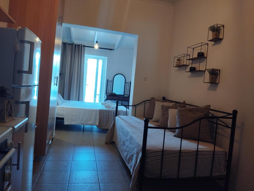 Postel nebo postele na pokoji v ubytování To limanaki
