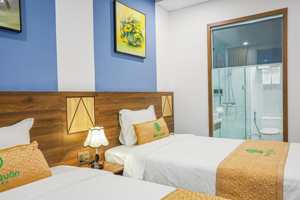 Postel nebo postele na pokoji v ubytování Minh Quan Hotel - Da Nang Center By HOS