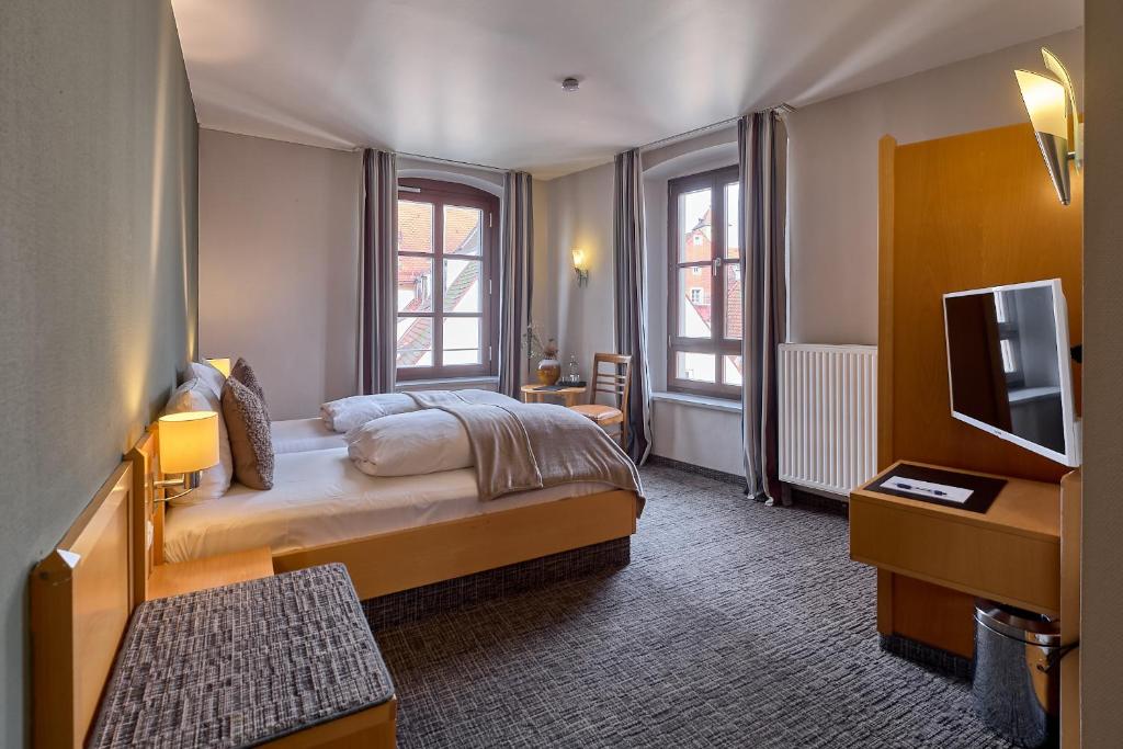 Postel nebo postele na pokoji v ubytování Hotel Roter Hahn