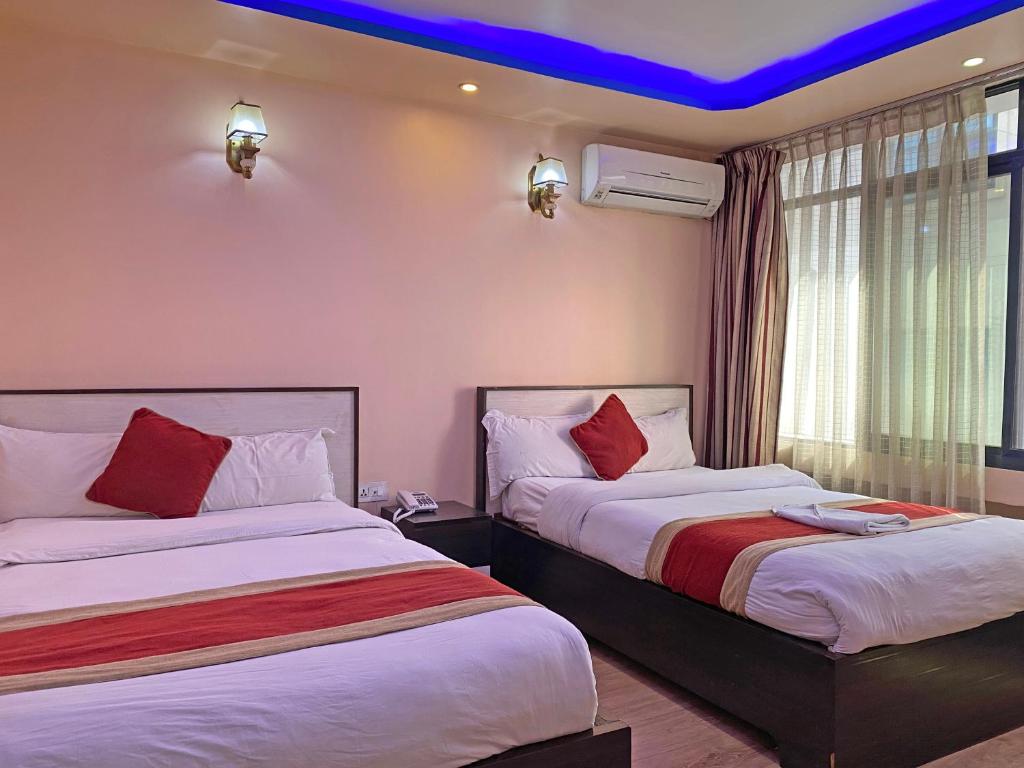 Postel nebo postele na pokoji v ubytování Hotel Readers Inn Pvt.Ltd