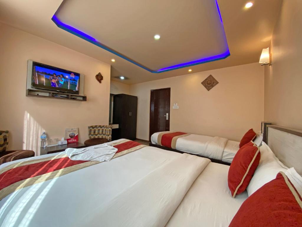 Postel nebo postele na pokoji v ubytování Hotel Readers Inn Pvt.Ltd
