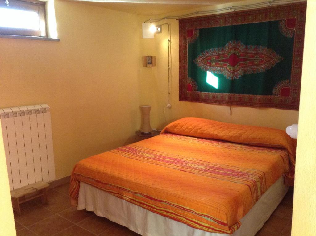 Кровать или кровати в номере Il soffio di Eolo