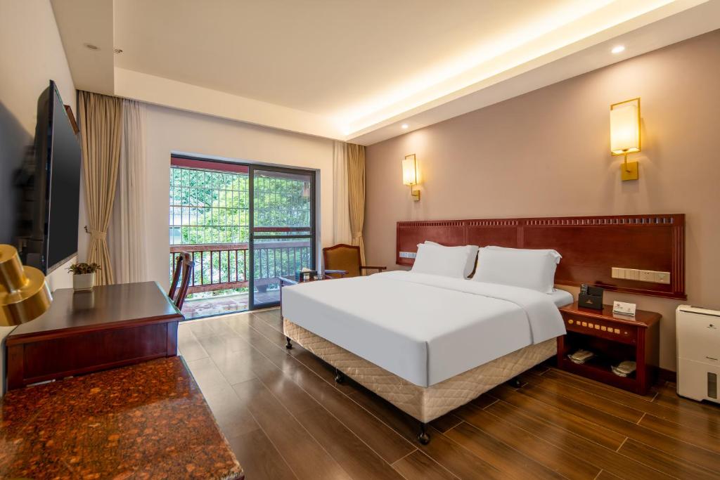 Postel nebo postele na pokoji v ubytování Hunan New Pipaxi Hotel