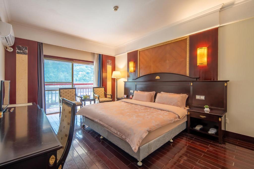 Postel nebo postele na pokoji v ubytování Hunan New Pipaxi Hotel