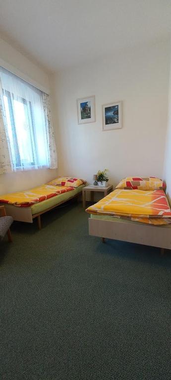 Postel nebo postele na pokoji v ubytování Prázdninový dům Sloup - Sloup v Čechách