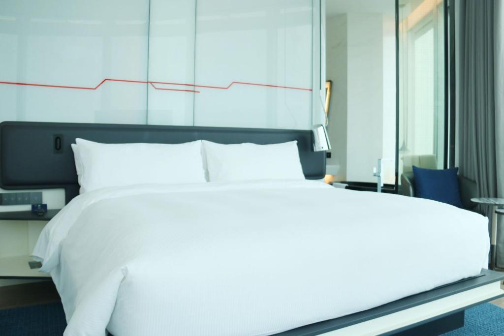 Postel nebo postele na pokoji v ubytování Doubletree by Hilton Foshan Nanhai-Free Canton Fair Shuttle Bus