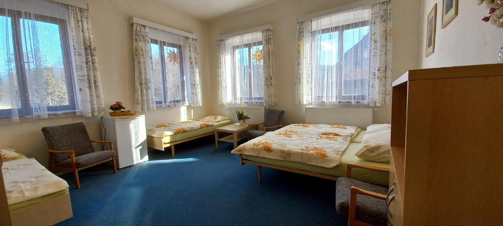 Postel nebo postele na pokoji v ubytování Prázdninový dům Sloup - Sloup v Čechách