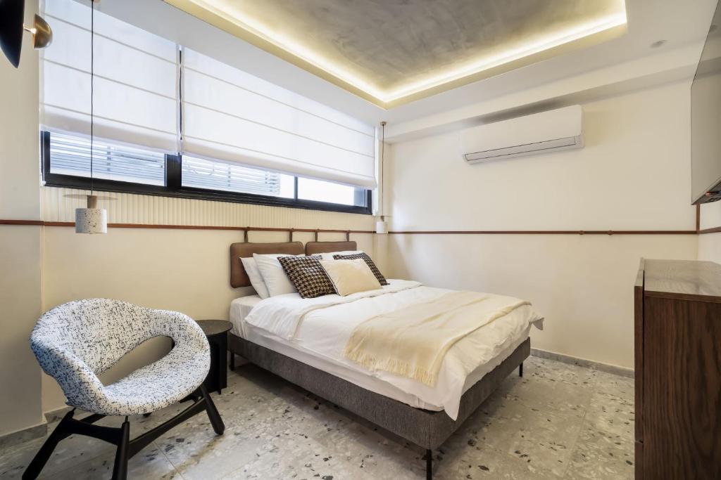 Postel nebo postele na pokoji v ubytování Mulan Hotel