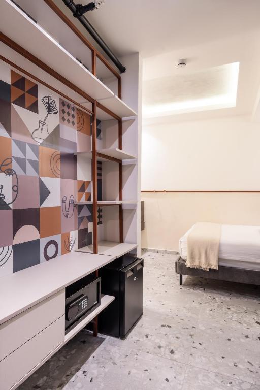 Postel nebo postele na pokoji v ubytování Mulan Hotel
