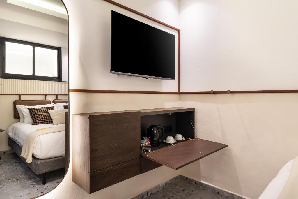 TV a/nebo společenská místnost v ubytování Mulan Hotel