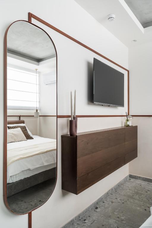 TV a/nebo společenská místnost v ubytování Mulan Hotel