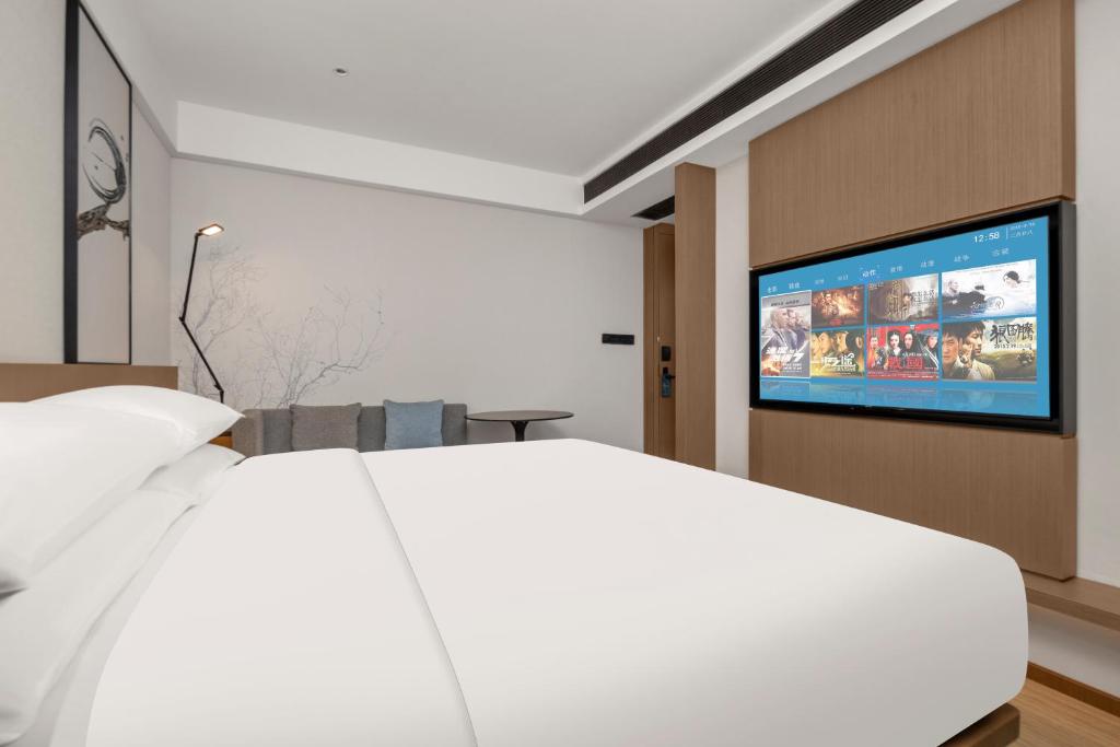 Fairfield by Marriott Changsha Yueluにあるテレビまたはエンターテインメントセンター