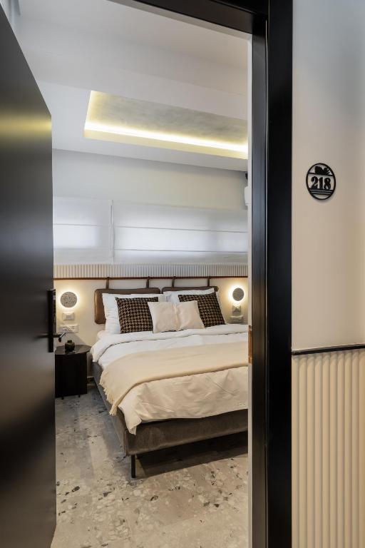 Postel nebo postele na pokoji v ubytování Mulan Hotel