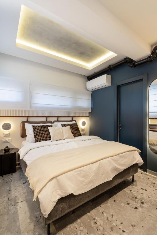 Postel nebo postele na pokoji v ubytování Mulan Hotel