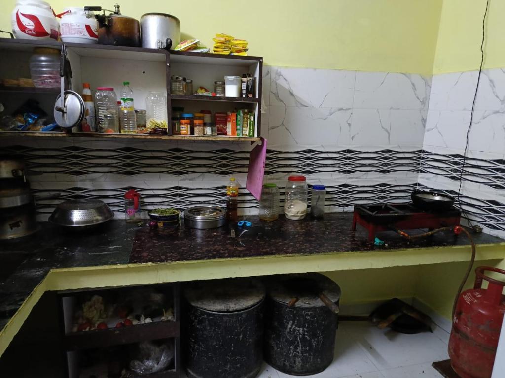 a counter in a kitchen with a counter top at Joshi Holiday Home Stay in Lansdowne