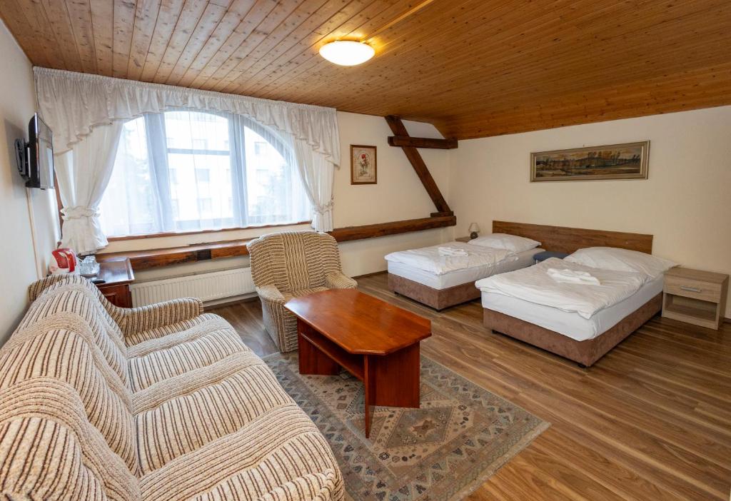 Postel nebo postele na pokoji v ubytování Pension Centrum
