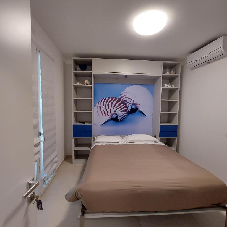 Voodi või voodid majutusasutuse Bed & Breakfast A Mare affitta camere toas