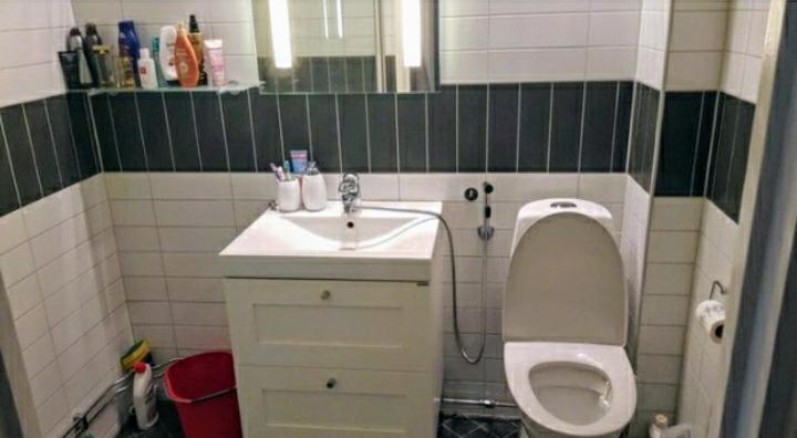 a small bathroom with a toilet and a sink at Bravo in Malmö