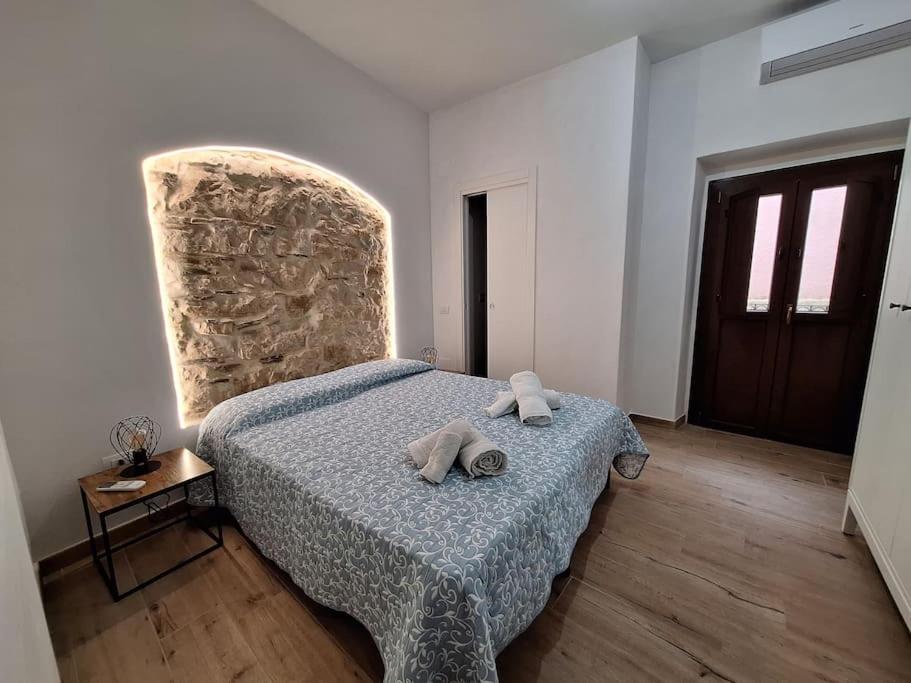 Postel nebo postele na pokoji v ubytování Dommu Amsicora