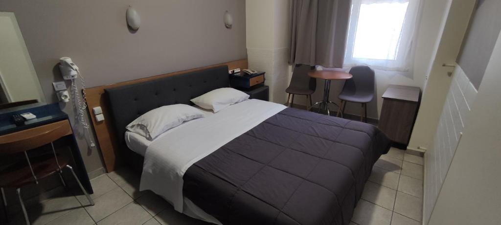 Postel nebo postele na pokoji v ubytování El Greco