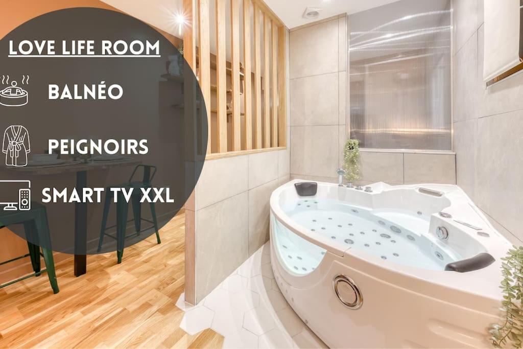 a bathroom with a bath tub in a room at Love Life Room-Jacuzzi-Netflix-Accès-24/7-Privé in Étampes