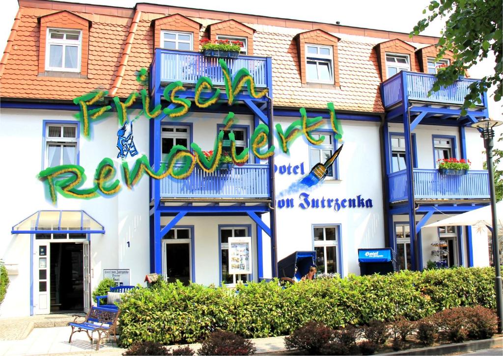 a building with a sign that reads reyneslevard hotel on singapore at Hotel von Jutrzenka in Kühlungsborn