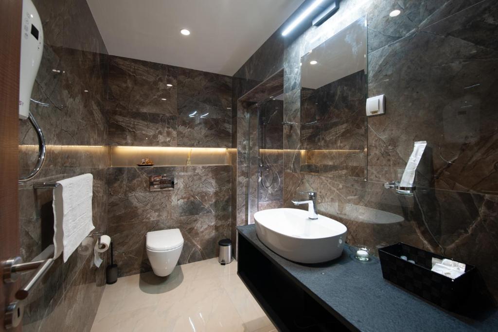 Koupelna v ubytování Hotel Kralj