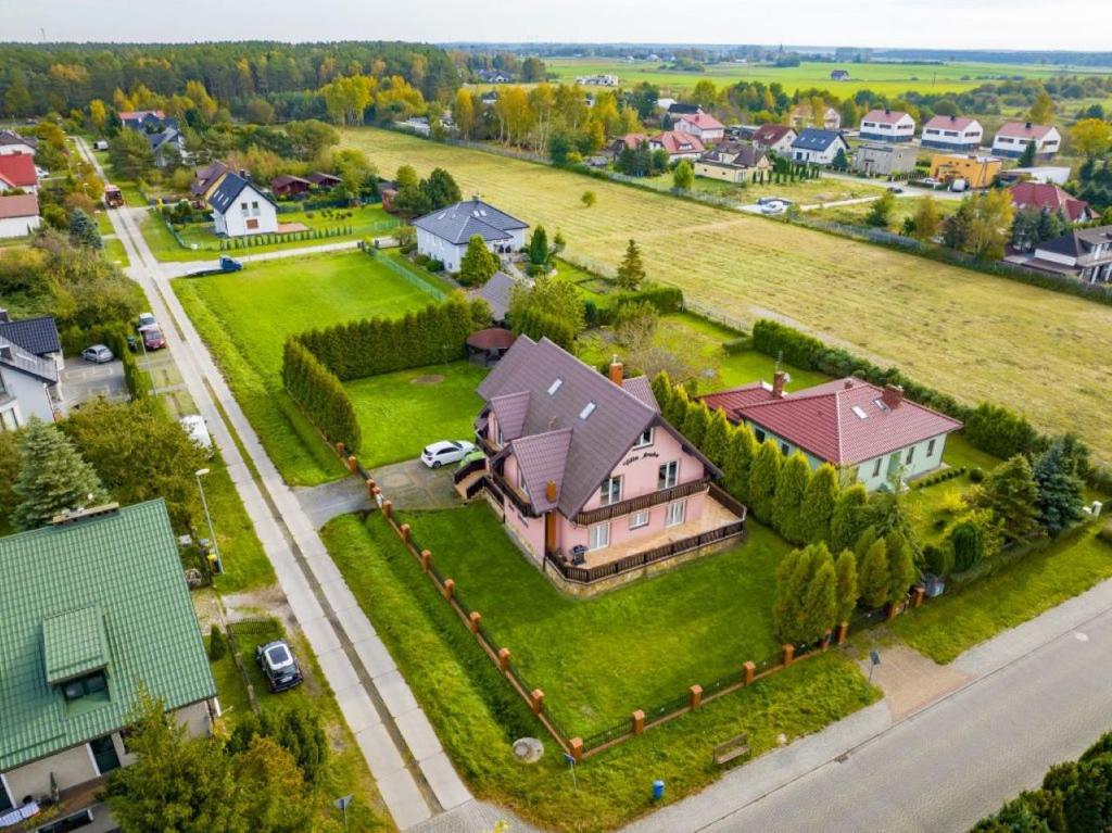 an aerial view of a house with a yard at Villa Aruba in Grzybowo