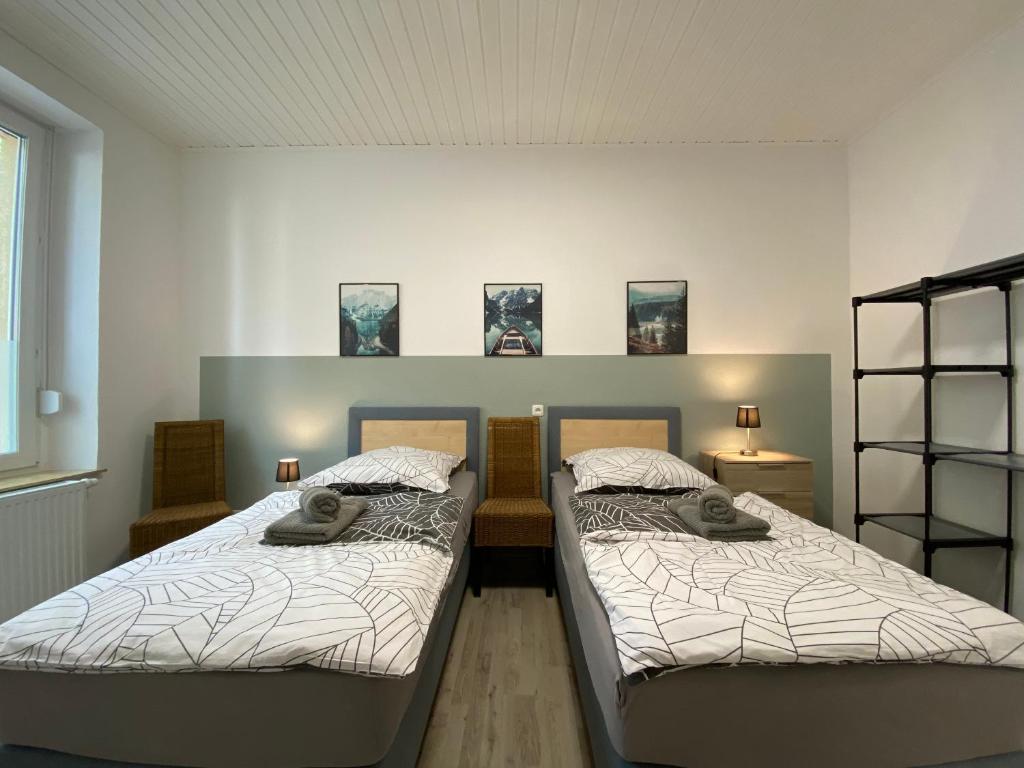 Кровать или кровати в номере Rudi Homes Essen #1