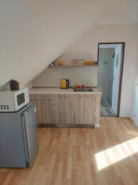 Kuchyň nebo kuchyňský kout v ubytování Apartmány Pod Koulí