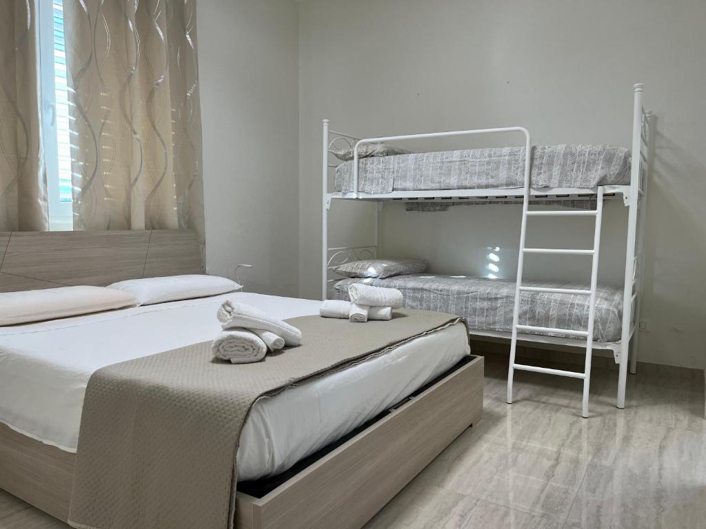 Postel nebo postele na pokoji v ubytování Salento Appartamento Sole