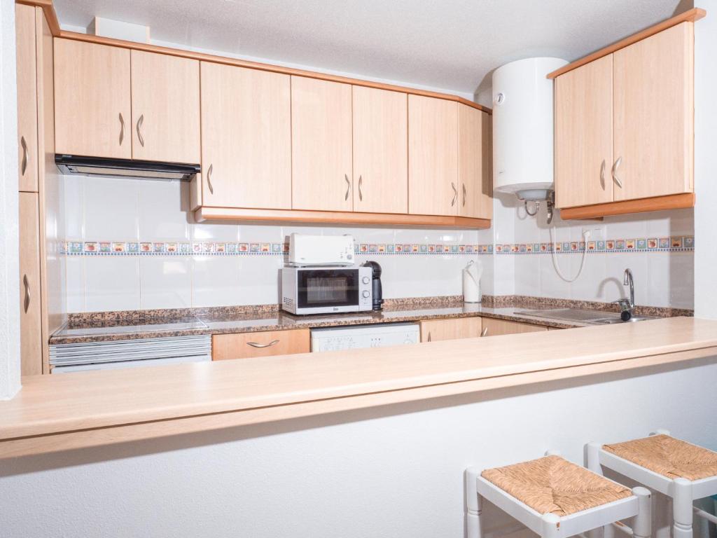 Kuchyňa alebo kuchynka v ubytovaní Apartamentos El Calón Playa