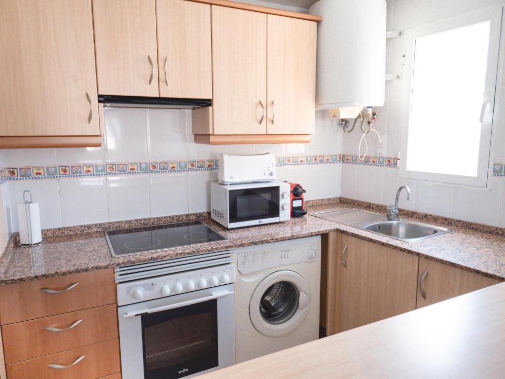 Kuchyňa alebo kuchynka v ubytovaní Apartamentos El Calón Playa