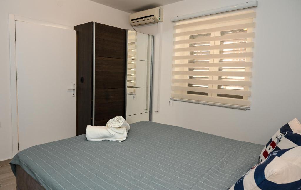 Postel nebo postele na pokoji v ubytování Porto Azzurro apartments