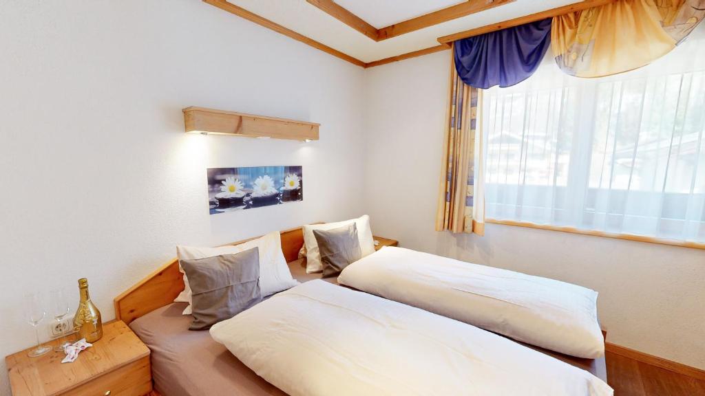 Postel nebo postele na pokoji v ubytování Appartements Hofer