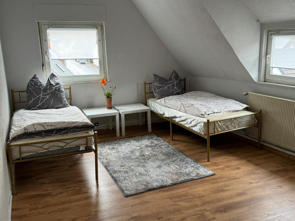 Кровать или кровати в номере Schelder Gästezimmer