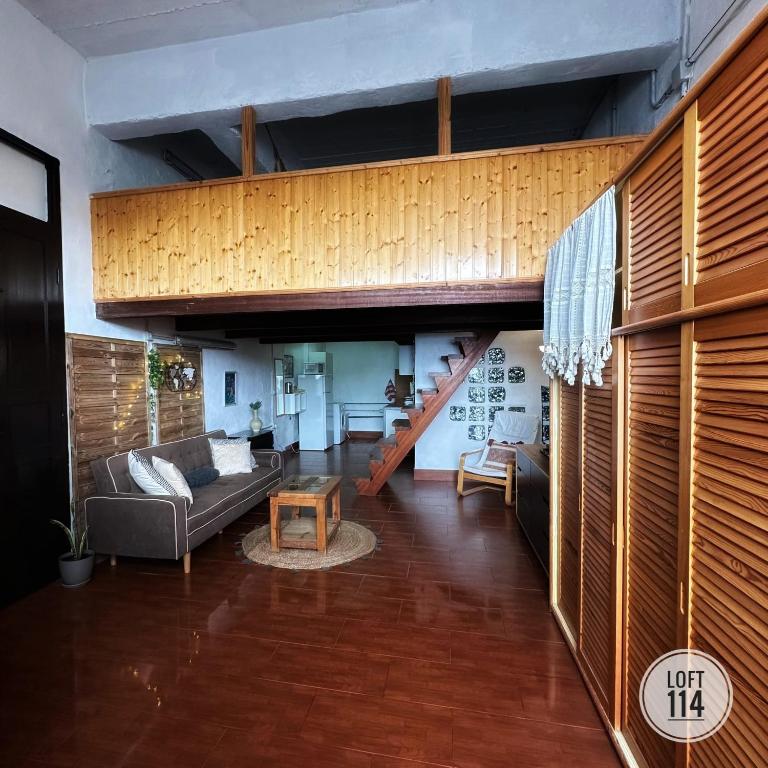 a living room with a couch and a loft at LOFT-114 in Santa Cruz de Tenerife