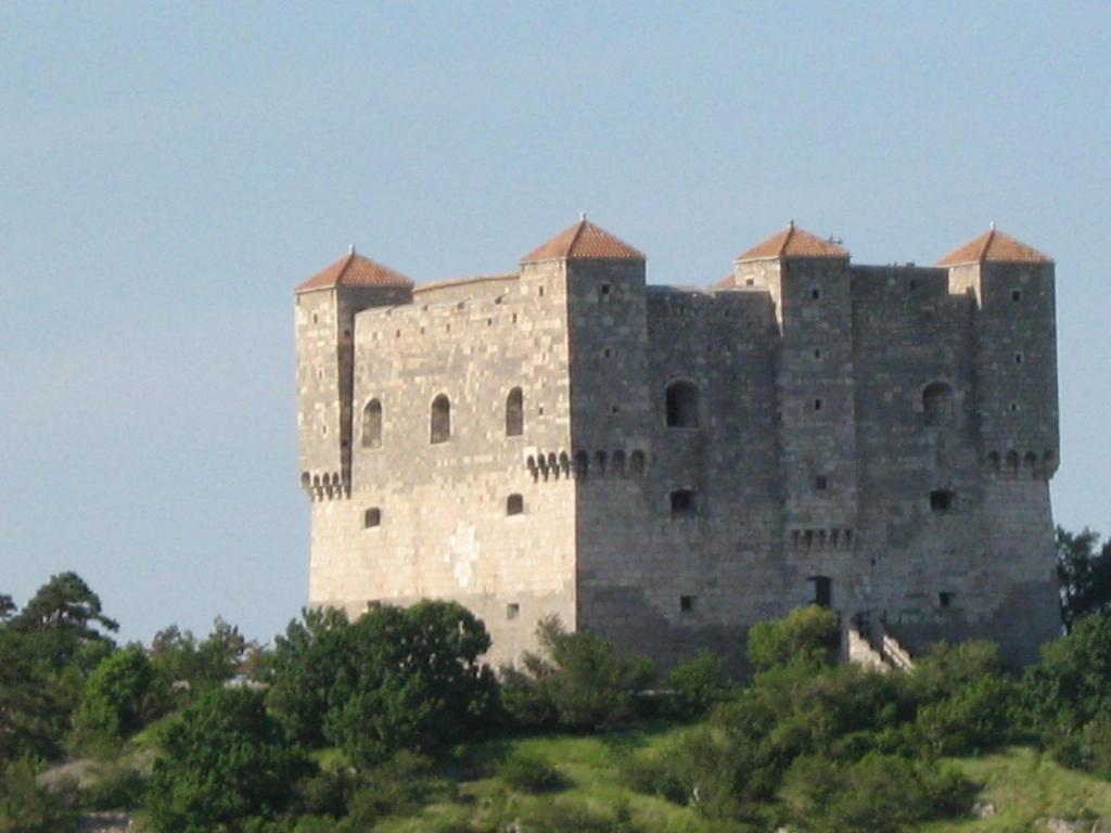 a large castle on top of a hill at Apartments Laura in Senj