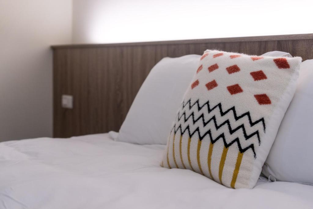 Postel nebo postele na pokoji v ubytování GOLD HOME
