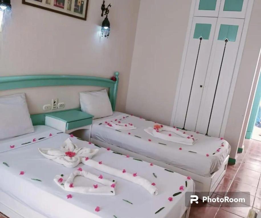 Postel nebo postele na pokoji v ubytování Badawia Sharm Resort