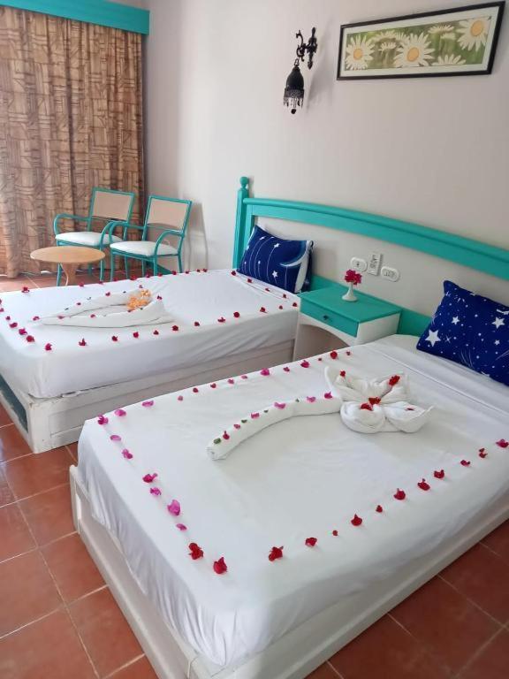 Postel nebo postele na pokoji v ubytování Badawia Sharm Resort