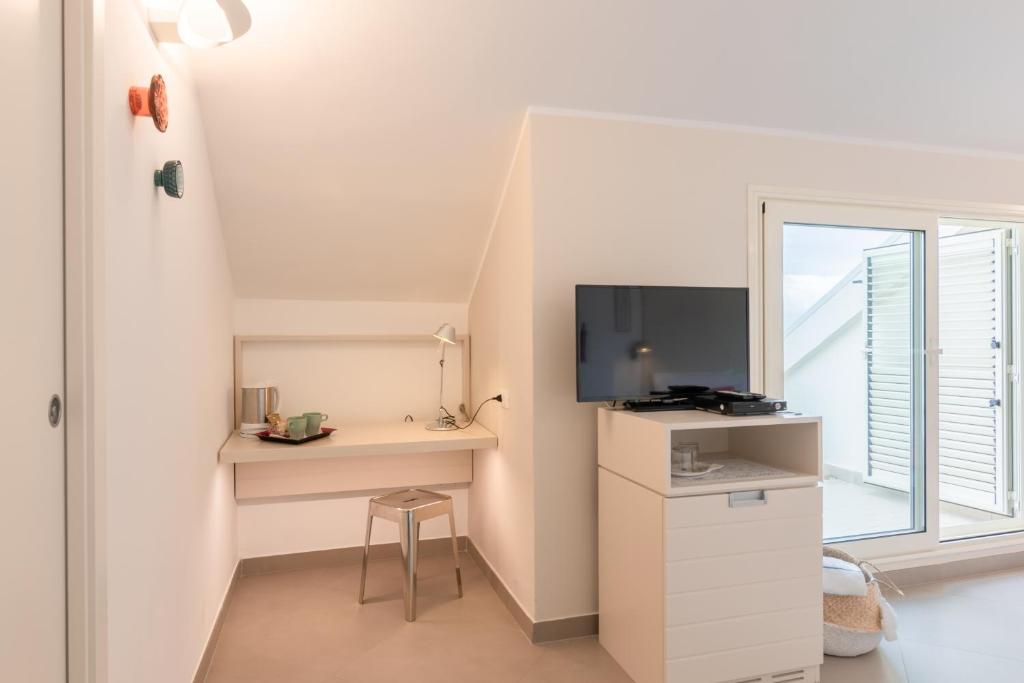 Kuchyň nebo kuchyňský kout v ubytování Albergo Punta de l'Est