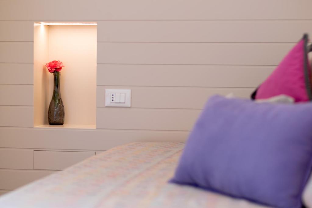 Postel nebo postele na pokoji v ubytování Albergo Punta de l'Est