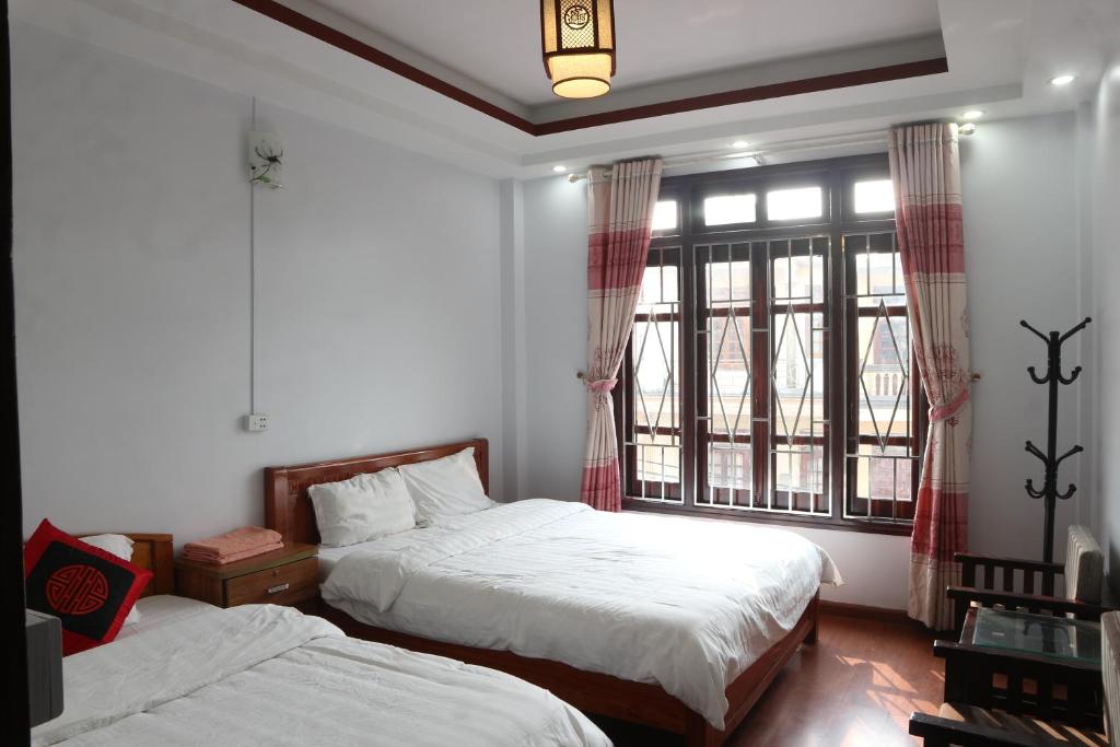 Postel nebo postele na pokoji v ubytování May Nui Sa Pa Hostel